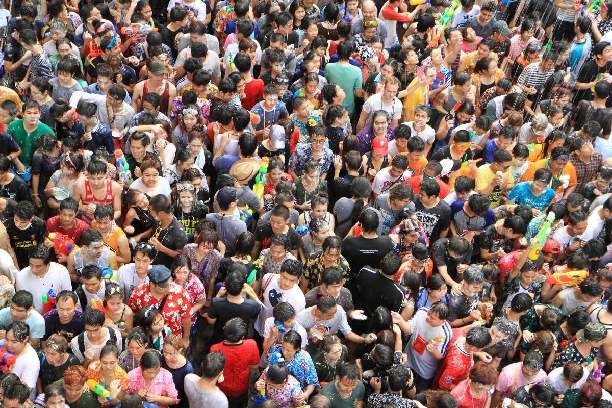 people celebrating songkran phuket festival in saphan hin park